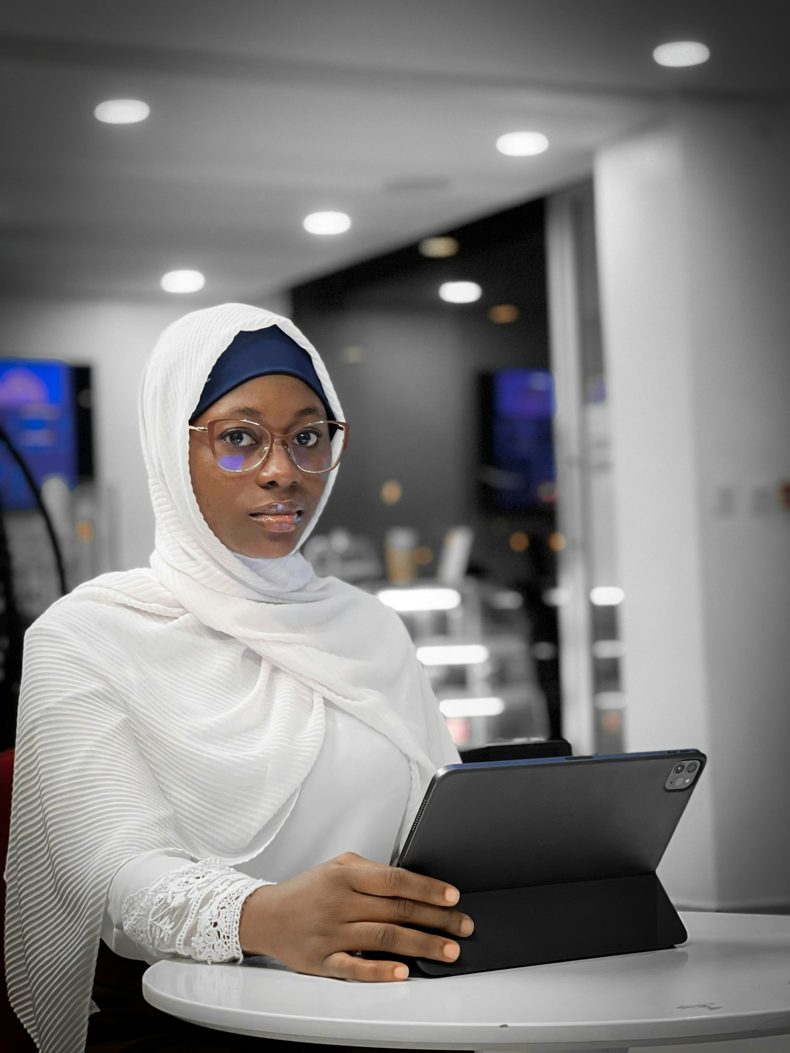 Professional reviewing bookkeeping records on a laptop