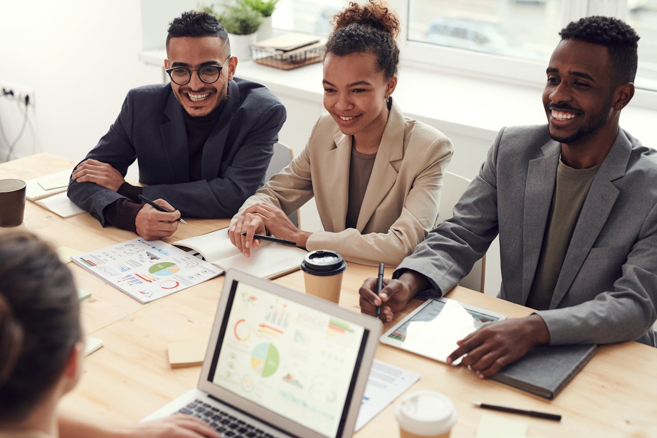 Diverse team discussing payroll compliance